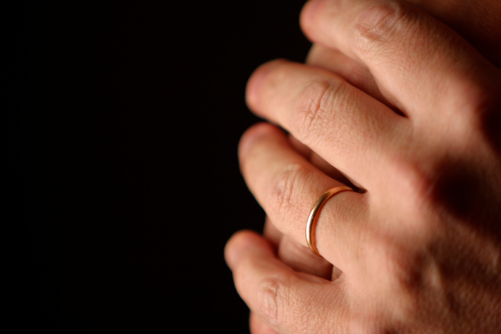 Hands Clasped with Wedding Band
